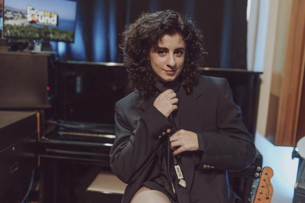 PORTRAIT MARILINA BERTOLDI FIXING TIE IN SUIT JACKET